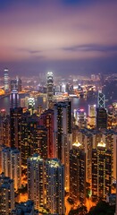 Naklejka premium Cityscape at night with illuminated buildings.