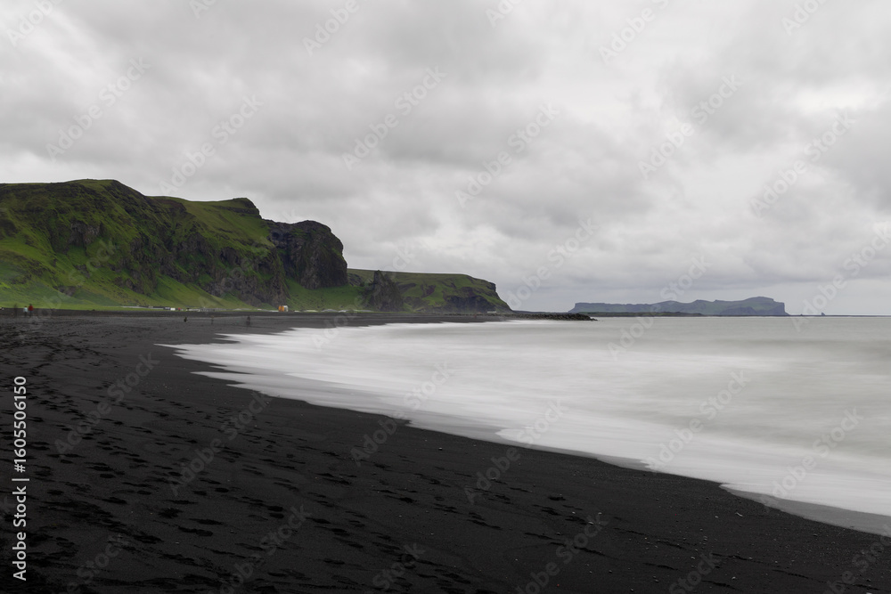 Canvas Prints cloudy view of black sand beach in vik during the day.