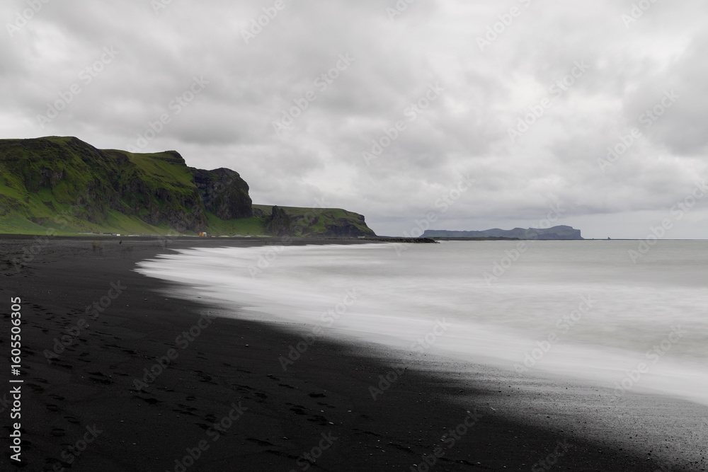 Canvas Prints cloudy view of black sand beach in vik during the day.