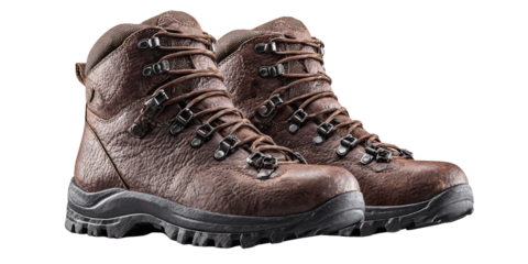 Pair of brown leather hiking boots with laces and black soles, isolated on black background Concept of outdoor adventure, trekking, and durable footwear