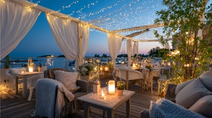 Cozy outdoor dining area with fairy lights, elegant decor, and soft furnishings, creating a romantic atmosphere for evening gatherings by the waterfront