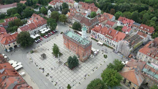 Stunning Aerial View of Sandomierz Historic Old Town, Showcasing Clock Tower and Vibrant Parking Lot Ideal for Website Banners, Perfect for Travel and History Themed Projects, Evoking a.