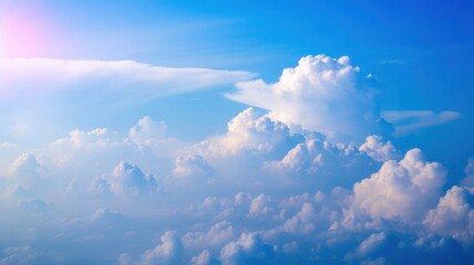 A mesmerizing aerial view of cumulus clouds blending with a vibrant blue sky expanse