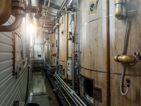 Craft beer production line, vats for beer fermentation - Powered by Adobe