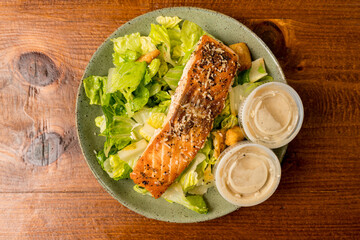 Caesar salad with grilled salmon