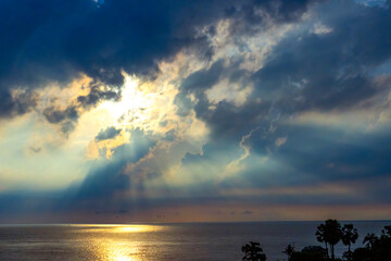 Dramatic Colorful Sunrays over Sea. Sky with Sunrays. Cloudscape Nature Background.