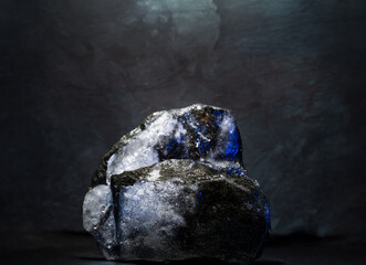 cosmetic background podium with ice and stones.real ice and stones with texture for presentation of...