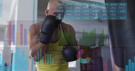 Athlete wearing green top, boxing gloves punching heavy bag in gym, with data overlays, copy space