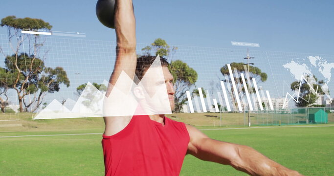 Pressing kettlebell overhead athlete in red sleeveless shirt on sports field, with graph overlays