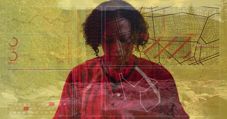 Woman in red collared shirt analyzing digital overlays in tech lab, with map grid panels visible