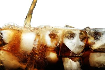 Pouring refreshing cola into glass with ice isolated on white