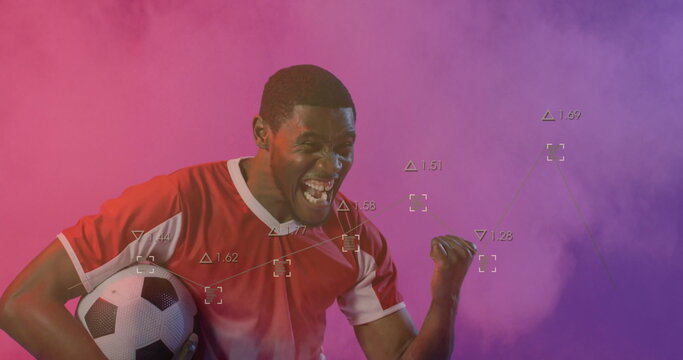 Pumping soccer player wearing red jersey celebrating win in studio, with ball performance overlays - Powered by Adobe