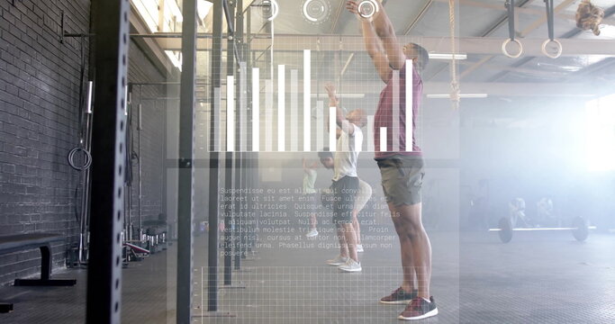 Reaching man in maroon athletic shirt gripping pull-up bar in CrossFit gym, with data overlay