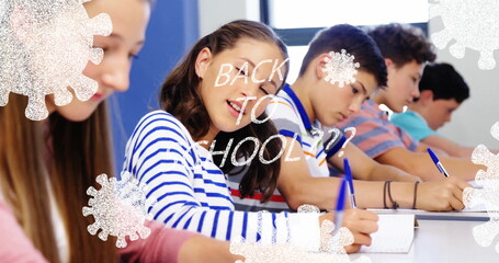 Five kids using spiral notebooks with blue pens in class, showing &ldquo;BACK TO SCHOOL??&rdquo; virus graphics