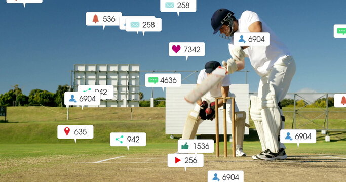 Swinging batsman holding cricket bat facing floating social media icons on grassy field, copy space
