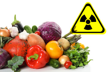 Fresh vegetables and radioactive sign on white background. Environmental contamination, polluted food