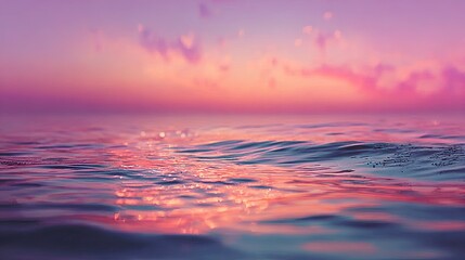Obraz premium Gentle ocean waves reflecting a vibrant sunset.
