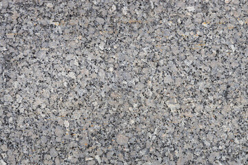 Closeup full frame texture background of solid natural blue and gray granite stone
