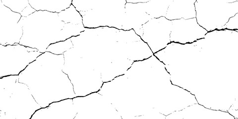 white surface with a network of black cracks across the surface area.