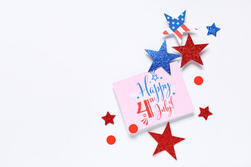Greeting card for Independence Day with paper stars in colors of USA flag on white background