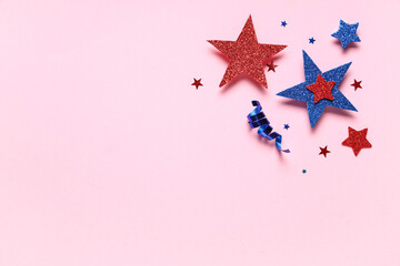 Paper stars with confetti in colors of USA flag for Independence Day on pink background