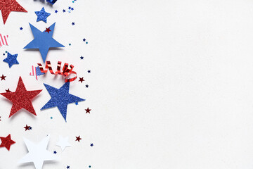 Paper stars with confetti in colors of USA flag for Independence Day on white grunge background