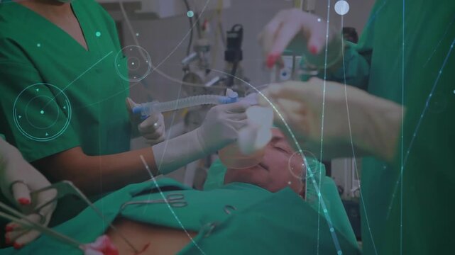 Nurse holding mask adjusting tubing starting laparoscopic surgery with team dissecting tissue