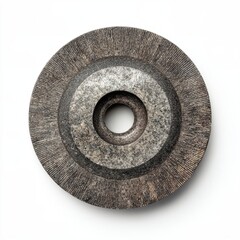 A close-up shot of a grinding wheel, showing its textured surface and central hole. The wheel is a tool for shaping and sharpening objects