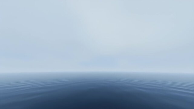 Serene ocean horizon on a misty day creates a tranquil and peaceful atmosphere showcasing calming blue waves against a soft, diffused sky providing