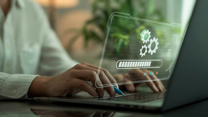 Close up of a person s hands typing on a laptop with a futuristic holographic interface displaying gears and the word automation