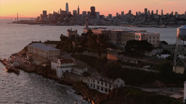 Alcatraz Island, USA, at sunset. The former prison is now a tourist destination. The city of San Francisco is in the background.