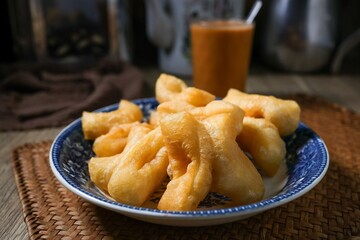 Thai style breakfast set , morning breakfast,chinese donut, youtiao, chinese breadstick	with hot tea