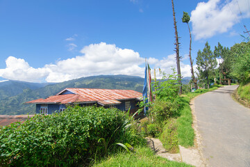 Beautiful way to Okhrey village, Himalayan mountain range in the background . Okhrey is a remote village with scenic natural vista in background, in Sikkim, India.