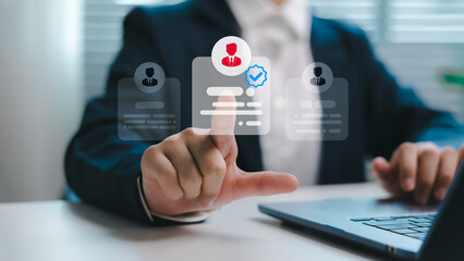 Businessman selecting top candidate on digital interface for recruitment process. Concept of talent selection, HR technology, online hiring, and human resource management in modern workplace.