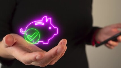 Person's hand holding a virtual, luminous icon of a piggy bank with a check mark - Powered by Adobe