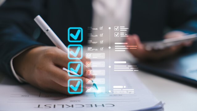Close-up of business hand using digital pen with checklist icon overlay. Concept of task management, workflow planning, and productivity system in digital business operation.