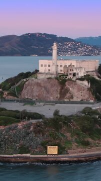 Alcatraz Island, USA, at dusk. The former prison is now a popular tourist destination. Visitors explore the island to learn about its history and infamous inmates.