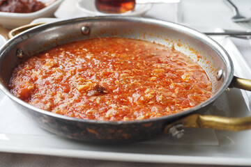 Traditional turkish menemen in a skillet for a hearty meal