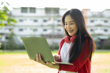 Fototapeta premium A cheerful young student wearing headphones