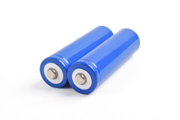 Two blue AA size batteries isolated on white backgraound