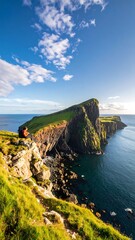 Coastal landscape with person on cliff