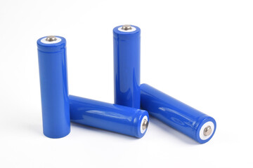 Alkaline batteries and a blue metal AA-size batteries isolated on white background, mockup