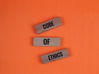 Code of Ethics Blocks on a Orange Background for Professional Concepts