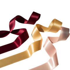 Elegant satin ribbons in burgundy gold and rose gold flowing against a dark background