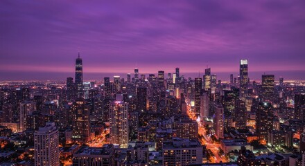 City skyline at night with purple sky
