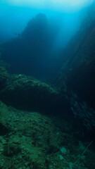 Underwater photograpy of mountain and dramatic landscape. From a scuba dive at Chumphon marine park in Thailand.