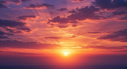 Colorful sunset with sun rays shining through the clouds