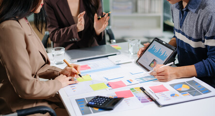 Business documents on office table with smart phone and calculator digital tablet and graph...
