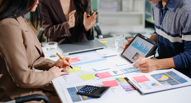 Business documents on office table with smart phone and calculator digital tablet and graph business with social network diagram