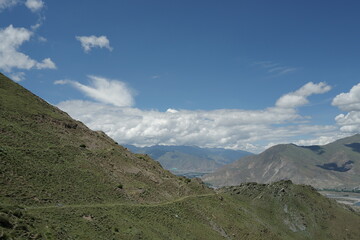 Naklejka premium the village sits in the river valley on the tibetan plateau, the highest on earth